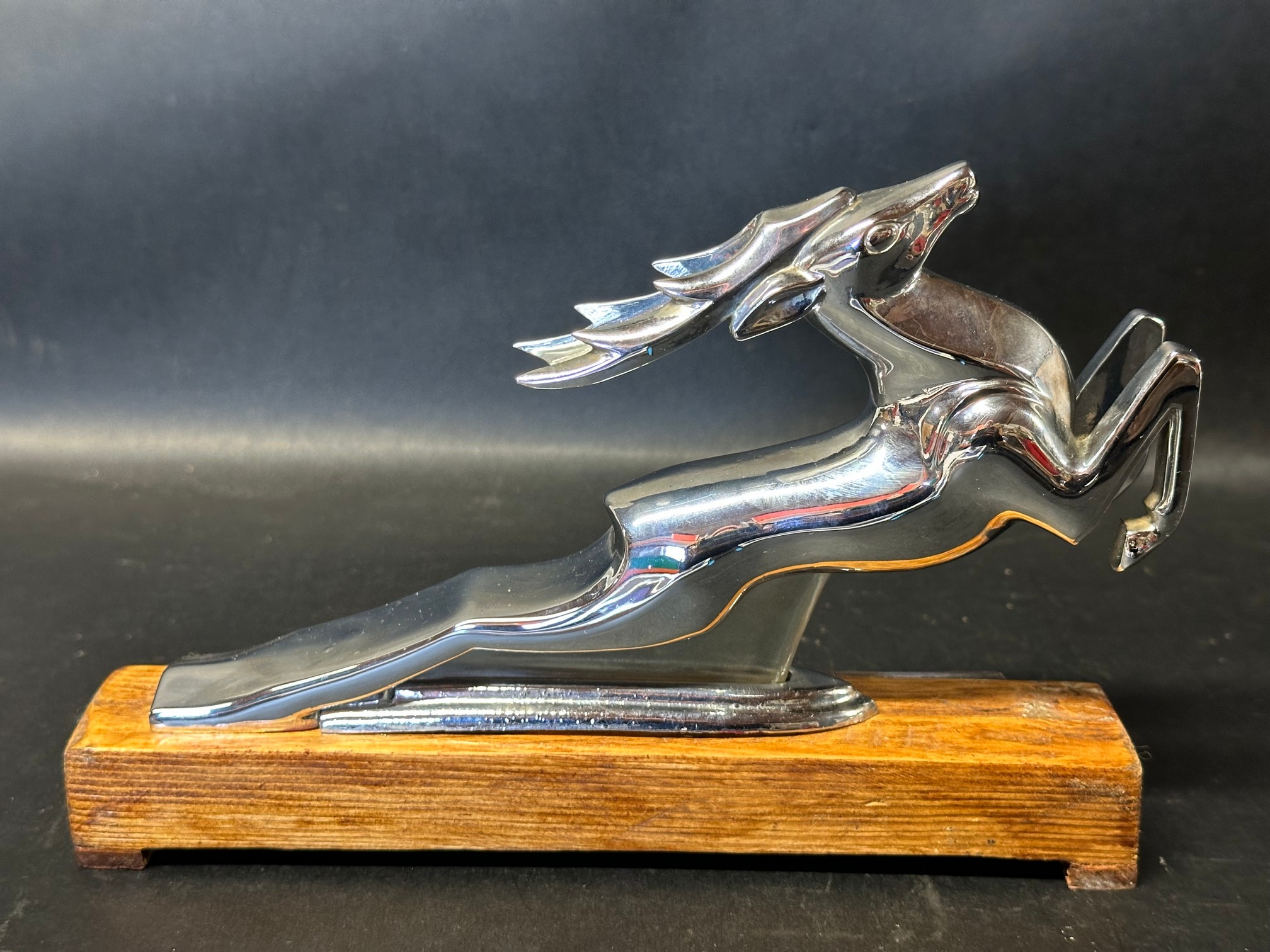 A Gaz Volga M21 car accessory mascot, 1957 (first series), mounted to wooden base with applied - Image 2 of 3