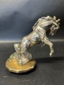 A mascot depicting a stallion, believed White Trucks or Mustang, mounted to radiator cap.