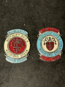 Two enamel supplier dashboard plaques, badges, emblems for W.J. Wells Ltd. of Woodford Green.
