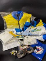 A quantity of motor racing-related promotional items including clothing, goggles, lapel badges,