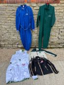 A selection of racing clothing inc. two overalls, an official USA-Japan series jacket, gilets etc.