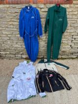 A selection of racing clothing inc. two overalls, an official USA-Japan series jacket, gilets etc.