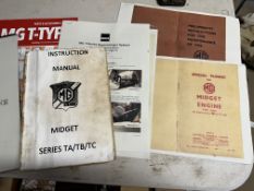 An MG T-type workshop manual and other related paperwork.