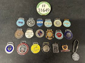 A collection of enamel key fobs, a bus conductor's badge and an MG keychain (20).