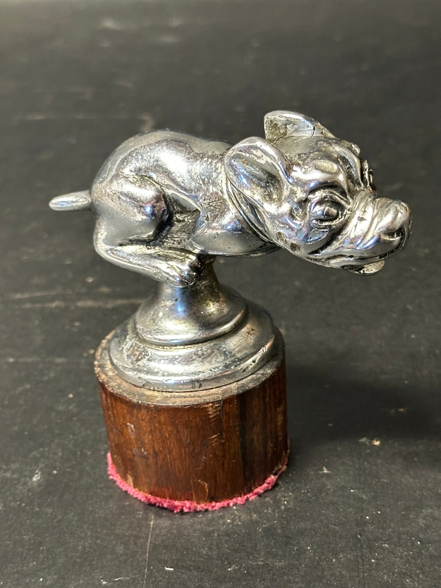 A Telcote pup car accessory mascot.