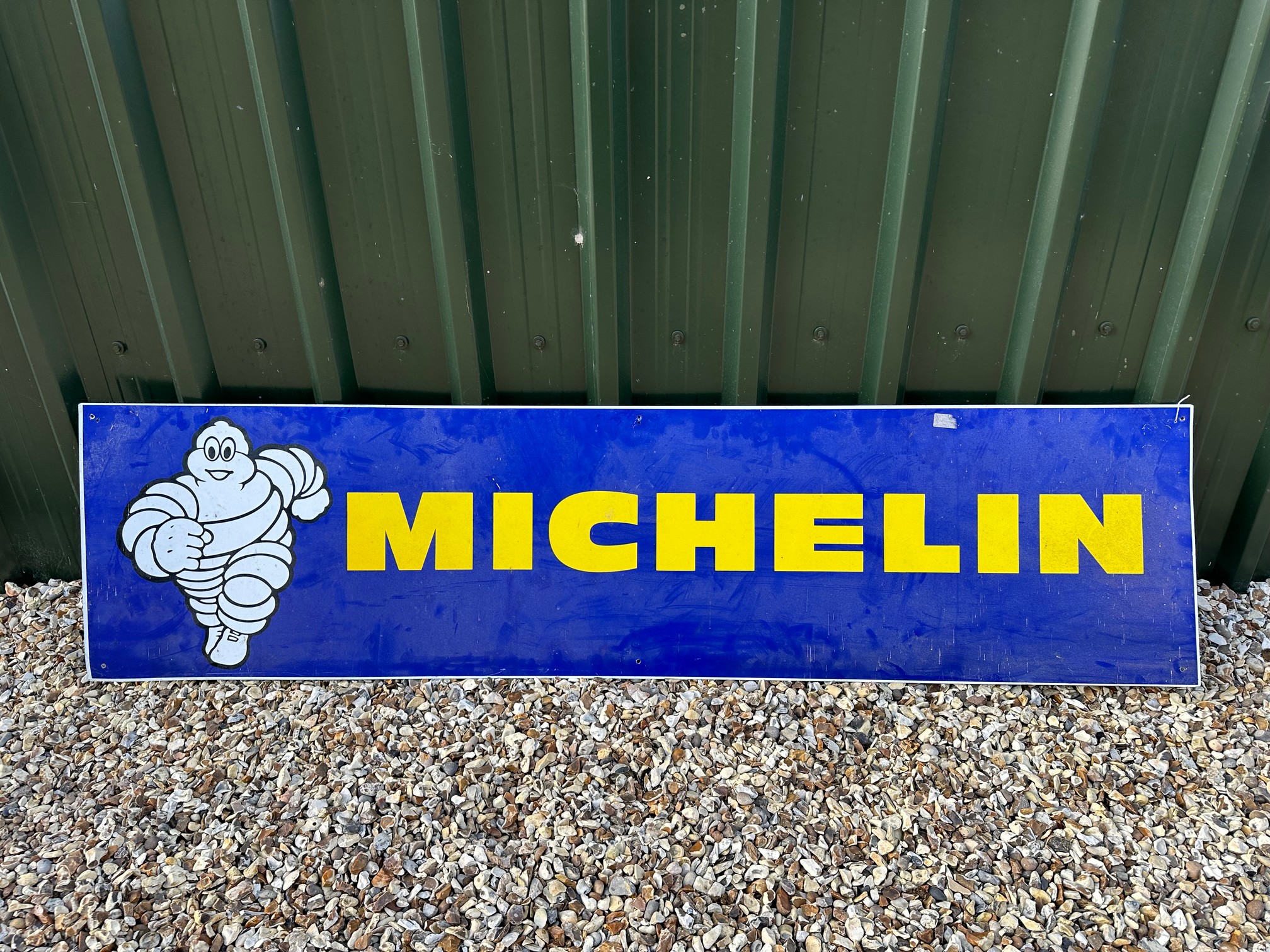 A Michelin (Mr Bibendum) tin advertising sign, 78 x 19 3/4".