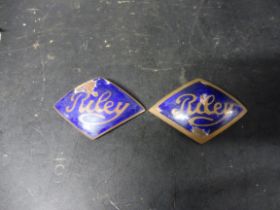 Two early Riley 9 enamel radiator badges.