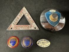 Three Ford dashboard supplier plaques, badges, emblems (two enamel, one celluloid), a Roote' tax