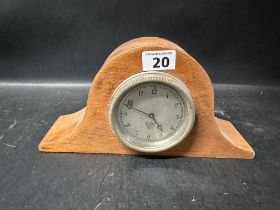 A Smiths MA car clock in wooden mantle housing.