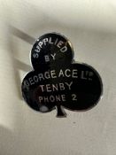 An early and rare enamel supplier's dashboard plaque, badge, emblem for George Ace Ltd. Tenby. Phone