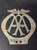 An AA car badge, no. 597374, modified with new drill holes, dates June-Dec 1926