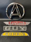 Four lorry/truck radiator name plates: Atkinson, Leyland, Guy and Morris.