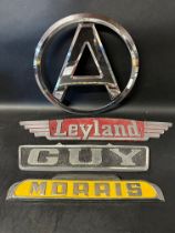 Four lorry/truck radiator name plates: Atkinson, Leyland, Guy and Morris.
