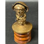 A rare car accessory mascot depicting "Mrs Maymore" by May & Padmore Ltd. of Birmingham, issued Xmas