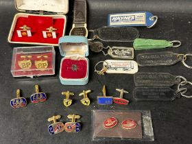 A quantity of motoring related cufflinks and dealer keyrings inc. Aston-Martin, BP, Ferrari,