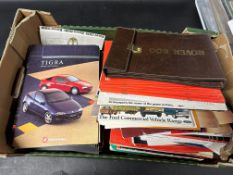 Two boxes of motoring volumes and handbooks including early Vauxhall Nova, Ford Trucks and other
