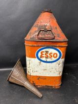 An Esso five gallon pyramid can and a Canco funnel.