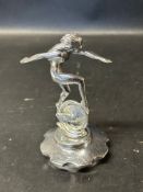 A car accessory mascot in the form of a female nude upona winged wheel, stamped AEL (Lejeune for