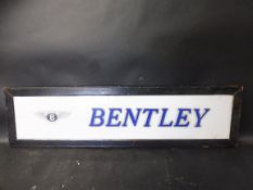 A Bentley showroom sign, perspex panel in wooden hanging frame, 39 1/2 x 10 1/2".