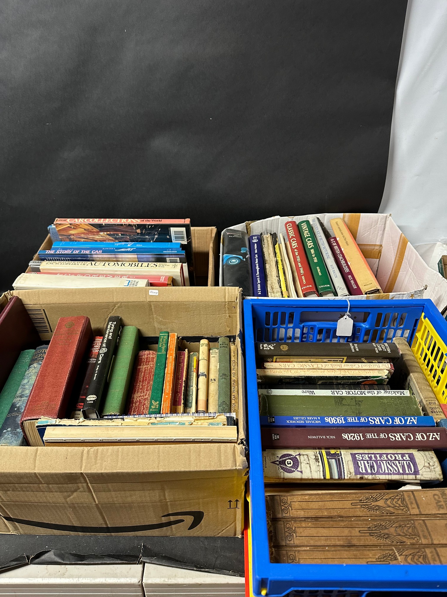 Four boxes of motoring-related volumes.