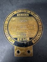 A Southern African Veteran & Vintage Association (S.A.V.V.A.) car badge etched 1948 M.G. 932.