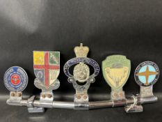 A badge bar holding five car badges: Royal Navy & Royal Marines, Royal College of Veterinary