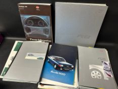 A collection of Audi related literature/brochures including an R8 coffee table book.