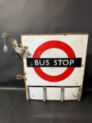 A Bus Stop double sided bracket sign with Fare Stage attachment, 20 1/2" tall x 21" wide overall.