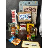 An autojumbler's lot of tins, a helmet, gunk, a US license plate, Servol can etc.