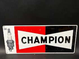 A Champion aluminium advertising sign depicting a Champion Spark Plug, 23 3/4 x 10".