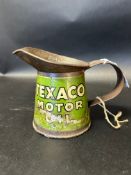 A Texaco Motor Oil pint measure.