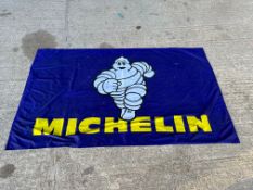 A Michelin Mr. Bibendum nylon banner/tablecloth, 75 x 45".