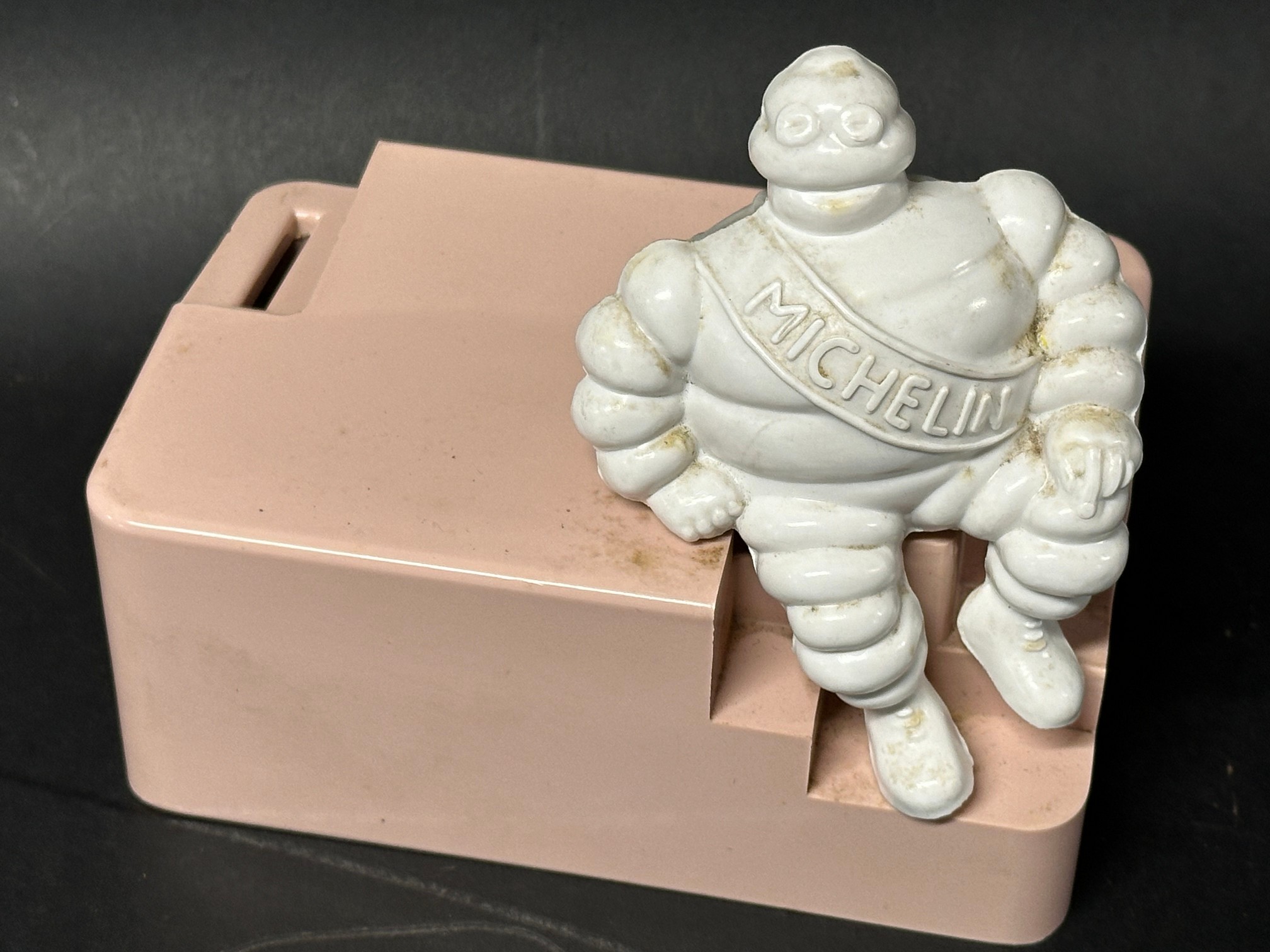 A 1950s Michellin Bibendum 'Baby Girl' moneybox, 5 1/4" tall.