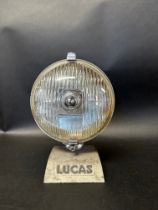A Lucas counter top display stand with spotlight.