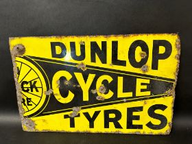 A Dunlop Cycle Tyres double sided enamel advertising sign, 22 x 14" - part of an original sign.