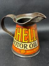 A Shell Motor Oil quart pourer.