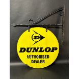 A Dunlop Authorised Dealer circular double sided enamel advertising sign on hanging bracket, 21 1/
