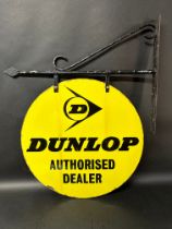 A Dunlop Authorised Dealer circular double sided enamel advertising sign on hanging bracket, 21 1/