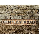 A heavy cast iron road sign for Bentley Road, 35 1/4 x 5 3/4".