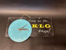 A K.L.G Plugs tin advertising clock, 18 x 8".
