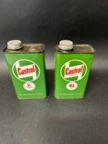 A Castrol XL 30 quart can and Castrol ST Gear Oil quart can.