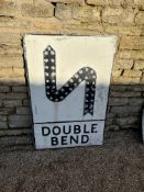 A Double Bend metal road sign with raised S-Bend and 43 reflectors, 28 x 42".