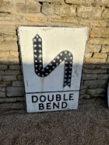 A Double Bend metal road sign with raised S-Bend and 43 reflectors, 28 x 42".