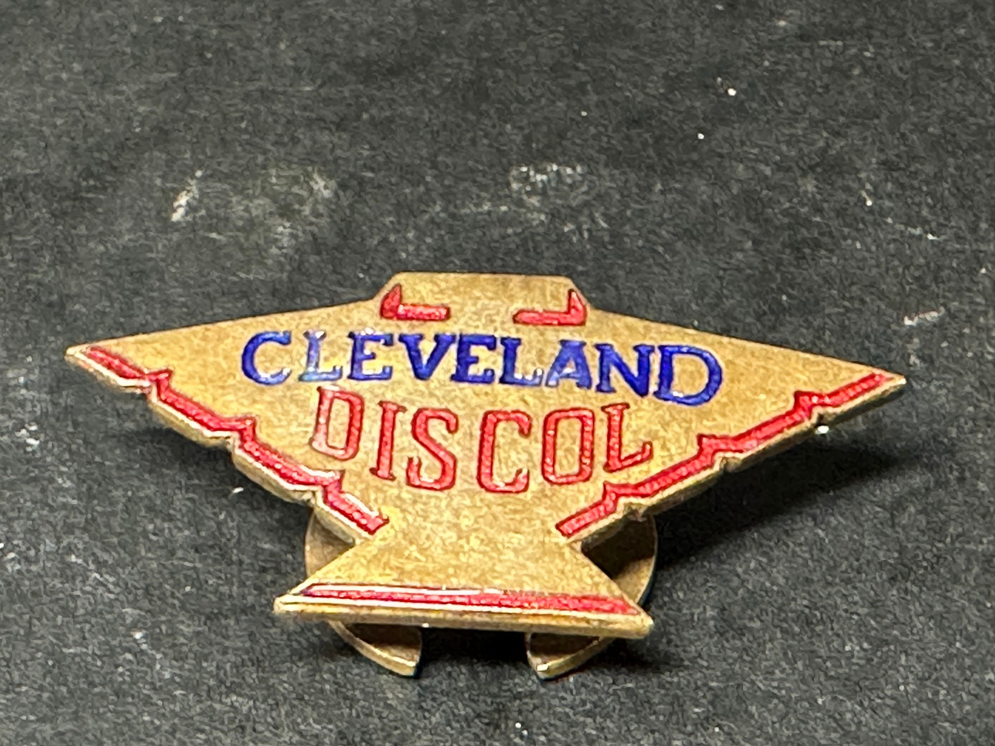 A Cleveland Discol badge, crescent shaped pin to verso.