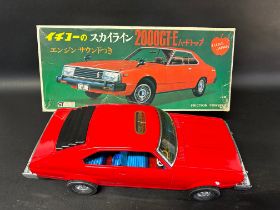 A Nissan Skyline 2000GT-E Japanese friction-powered toy car by Ichiko, in original box, appears