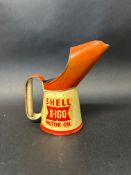 A Shell X-100 Motor Oil pint pourer.