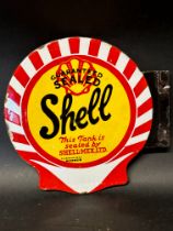 A Shell double sided enamel sign tag from a petrol pump advertising Shell-Mex Ltd.'s Guaranteed