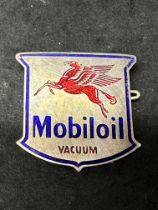 A Mobiloil Vacuum badge marked Foreign to verso.