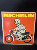 A Michelin tin advertising sign depicting Mr. Bibendum on a motorcycle, labelled G.A. Shankland