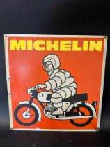 A Michelin tin advertising sign depicting Mr. Bibendum on a motorcycle, labelled G.A. Shankland